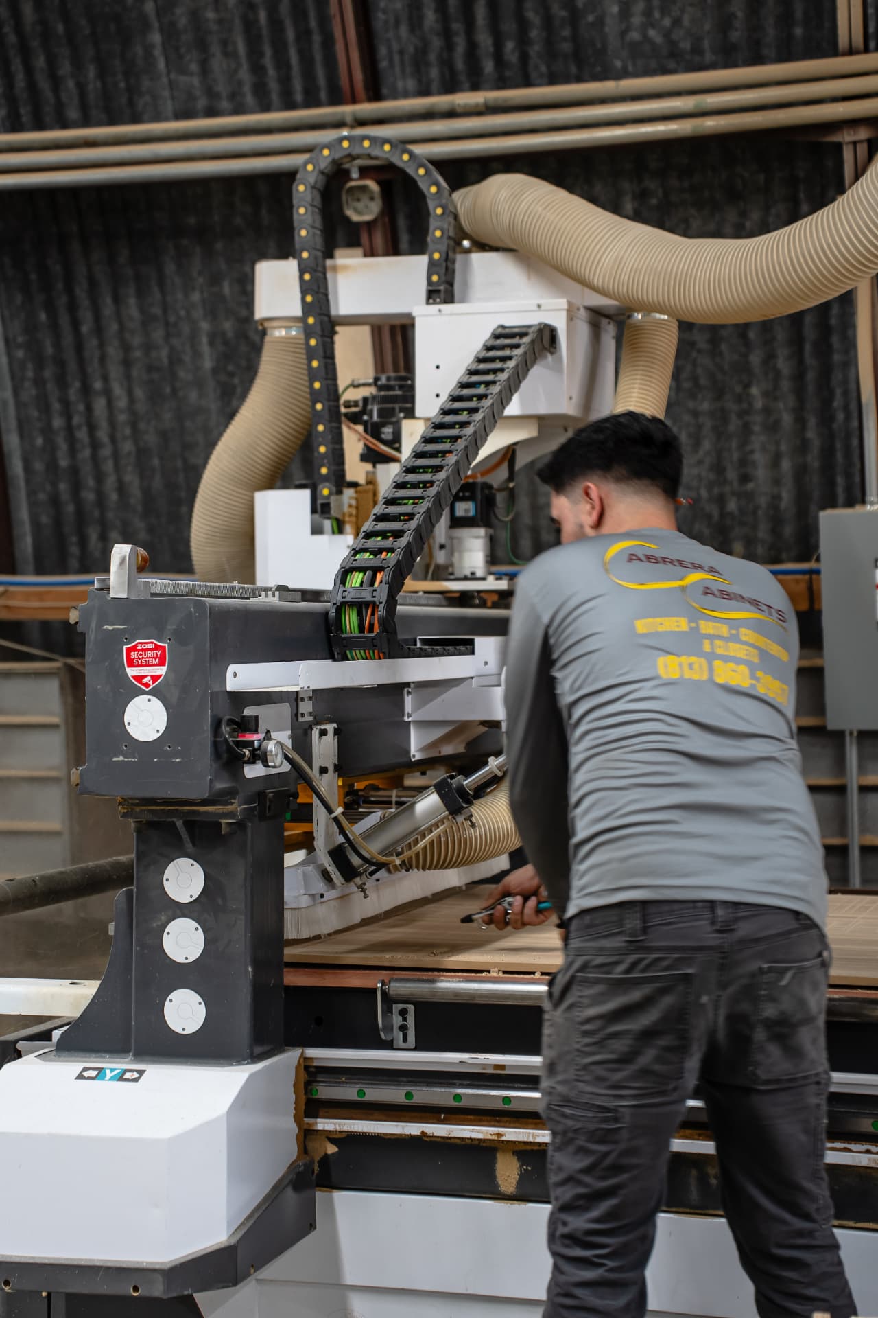 Cabinet maker producing cabinet panels in the Tampa factory